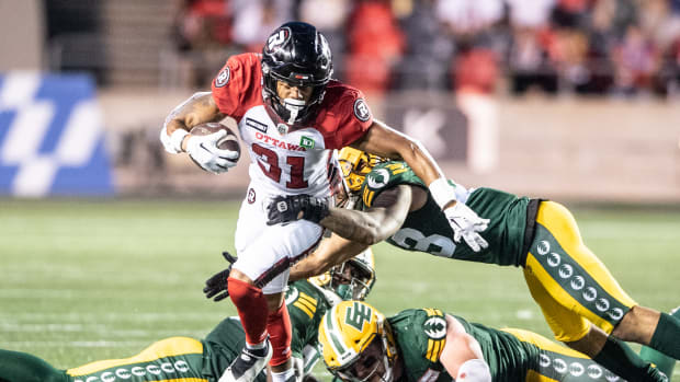 Aug 19, 2022; Ottawa, Ontario, CAN; Ottawa REDBLACKS running back Devonte Williams (31) runs the ball in the first half against the Edmonton Elks at the TD Place stadium. Mandatory Credit: Marc DesRosiers-USA TODAY Sports